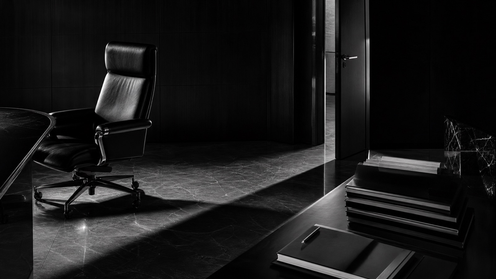 An empty executive chair and a stack of reports — the cost of a full-time CMO seat that founders skip comparing